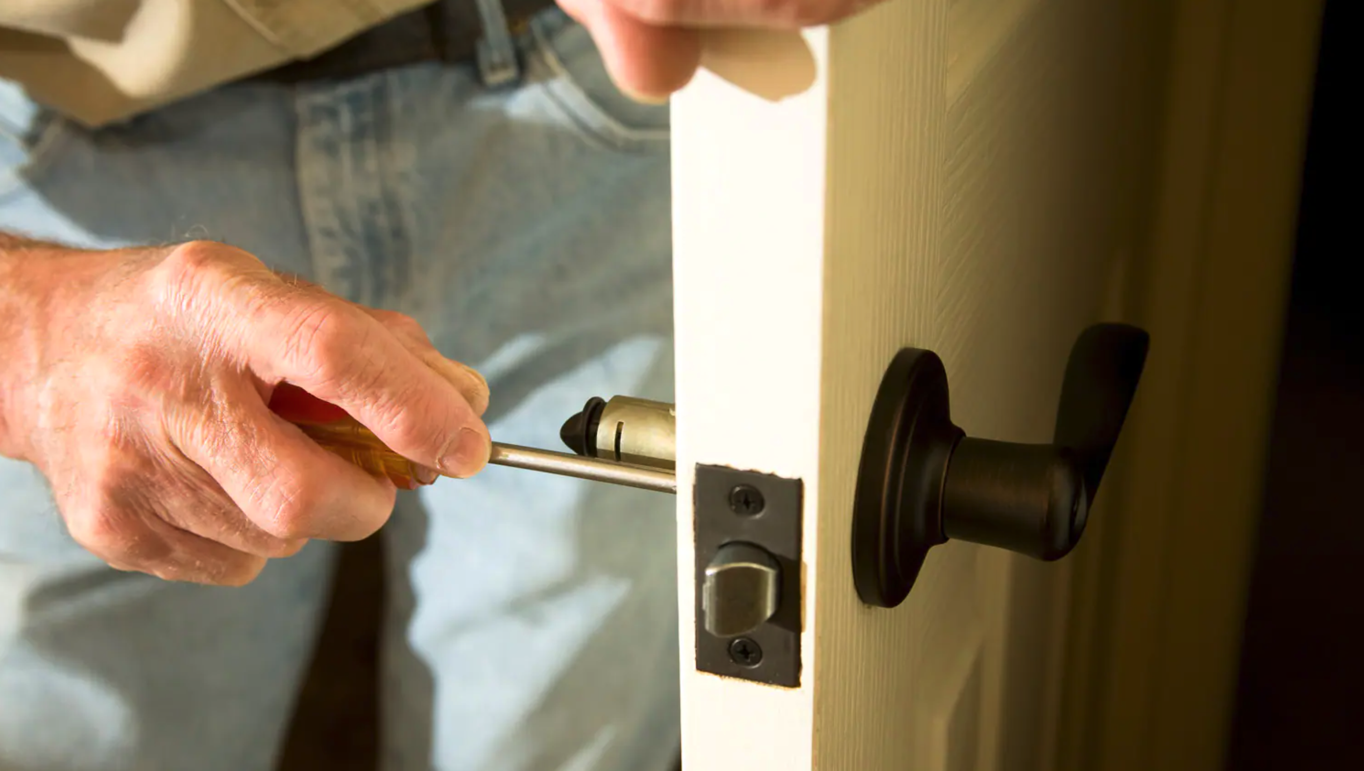 a locksmith changing a lock in belfast